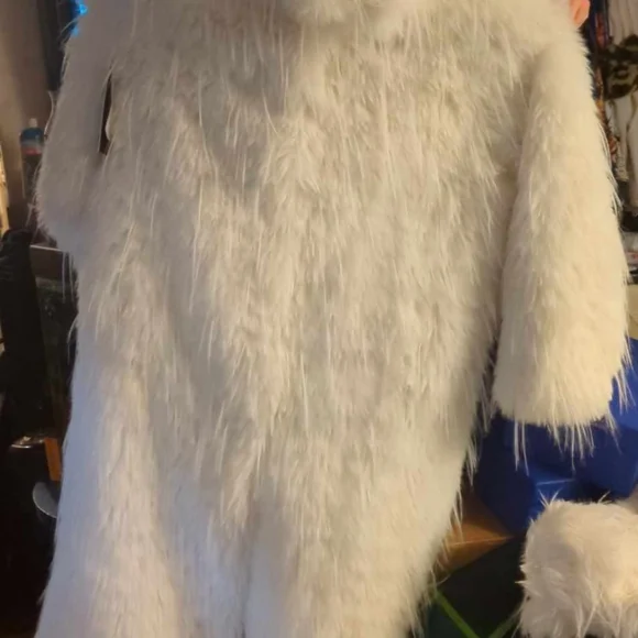 3 fur coats. 1 is shorter than the other 2 and 2 are the same.